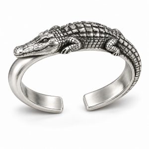 Silver-tone crocodile bangle design with raised back scales and a wraparound tail