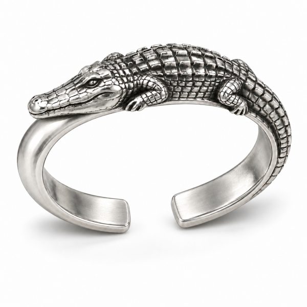 Silver-tone crocodile bangle design with raised back scales and a wraparound tail