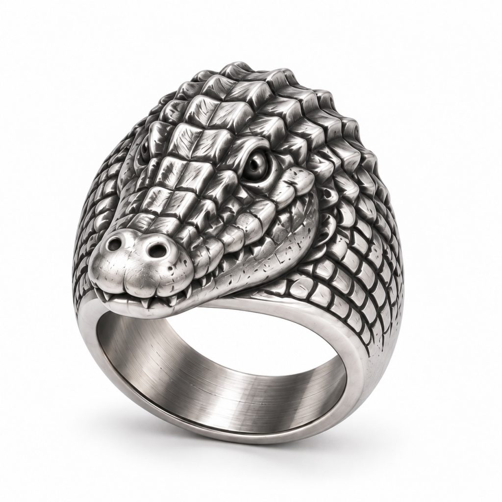 Silver-plated crocodile head ring with raised scales, a sculpted snout and a broad metal band.