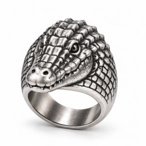 061-silver-plated-crocodile-head-ring Silver-plated crocodile head ring with raised scales, a sculpted snout and a broad metal band.