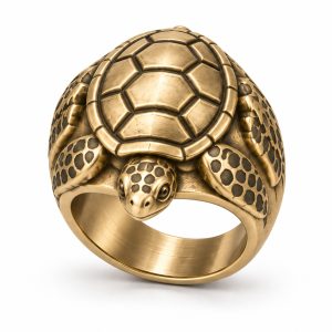 Gold-plated sea turtle ring with an oval patterned shell, sculpted flippers and a smooth inner band.