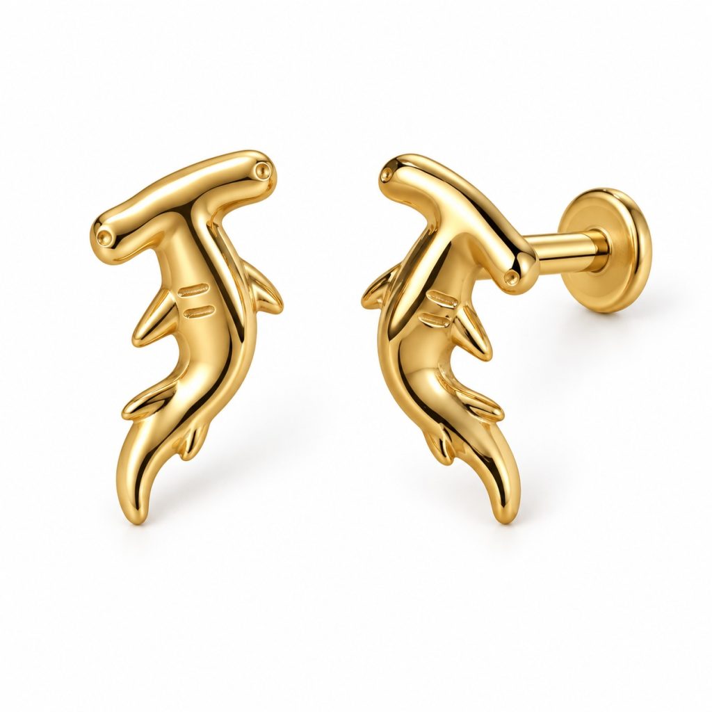 Pair of gold-tone hammerhead shark studs with curved bodies and circular flat disc backs