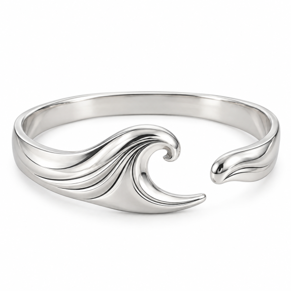 Silver-tone wave bangle with a sculpted ocean wave design