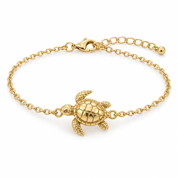 5 turtle bracelet- brass Gold-tone sea turtle chain bracelet laid flat with its fastening visible