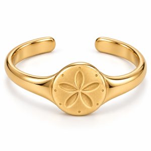 077 gold-tone-sand-dollar-cuff-bracelet Gold-tone sand dollar open cuff bracelet with a five-petal centerpiece and smooth tapered band on a white background