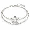 Silver-tone openwork sea turtle bracelet with cable and paperclip-style chains, lobster clasp and extension chain on white