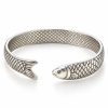 Silver-tone fish scale cuff bracelet with a sculpted fish head and forked tail facing across the front opening on a white background
