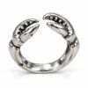 Silver-tone open ring with two facing crab claws and dark recessed details on a white background