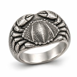 089 silver-tone-textured-crab-relief-ring Silver-tone wide band ring with a raised crab, textured shell and folded legs on a white background