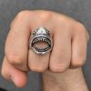 Silver-tone open mouth shark ring worn on a finger, showing its sculpted head, teeth and cutout mouth